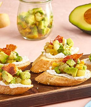 Crostini with Whipped Goat Cheese, Pear Chutney Guacamole, and Crispy Prosciutto